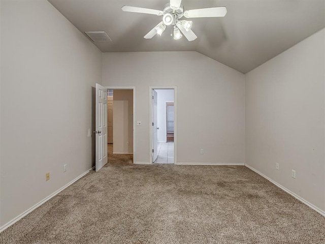 unfurnished bedroom with ceiling fan, light carpet, and vaulted ceiling