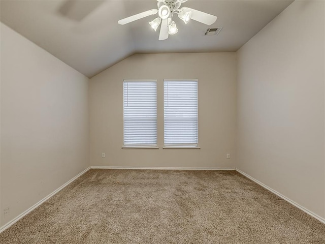 empty room with carpet, ceiling fan, and lofted ceiling