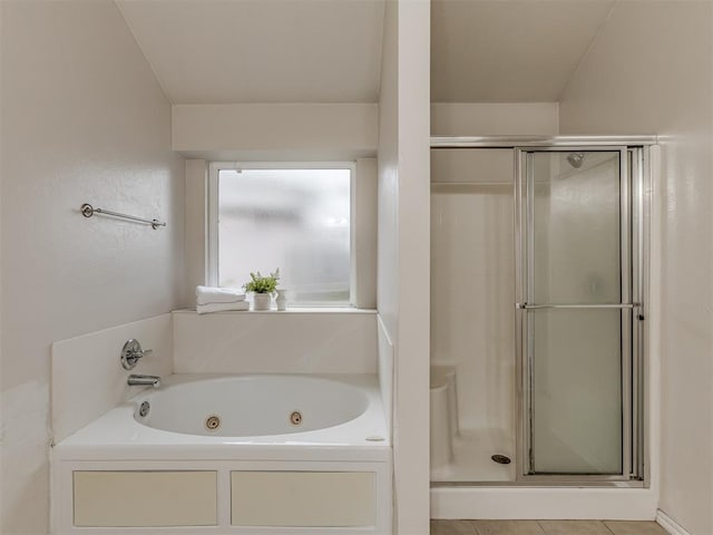 bathroom featuring a bath and tile patterned floors