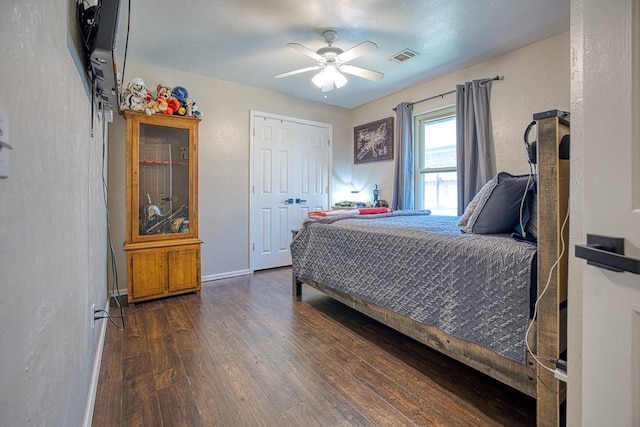 bedroom featuring dark hardwood / wood-style floors and ceiling fan