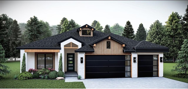 view of front of property with a garage and a front yard