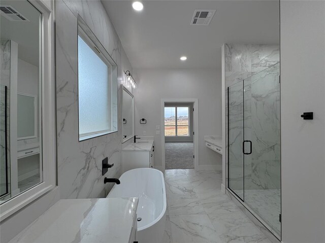 bathroom with plus walk in shower and vanity