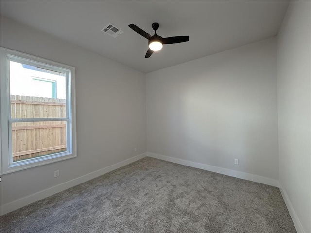 unfurnished room with ceiling fan and carpet floors