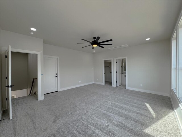 unfurnished bedroom with ceiling fan and light carpet