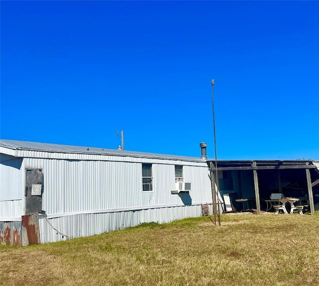 11322 Ns 3500th Rd, Prague, OK 74864 - rear view of house featuring a yard, an outbuilding, and an outdoor structure