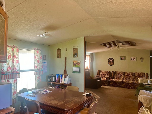 11322 Ns 3500th Rd, Prague, OK 74864 - dining room featuring ceiling fan, carpet, lofted ceiling, and a textured ceiling