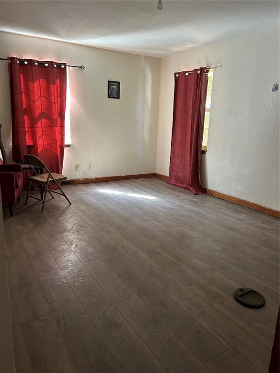 empty room with hardwood / wood-style floors