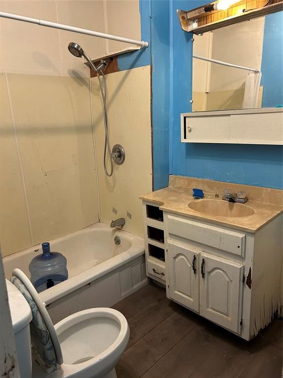 full bathroom with toilet, vanity, hardwood / wood-style flooring, and shower / tub combo with curtain