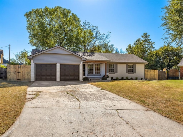 ranch-style house with a front yard and a garage