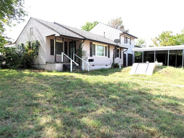 back of property with a porch and a yard