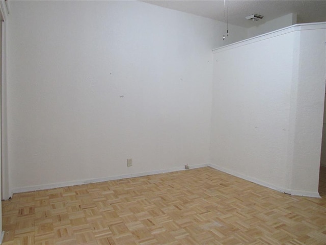 spare room with light parquet floors