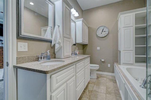 bathroom with a tub to relax in, toilet, tile patterned flooring, and vanity