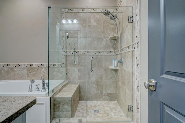 bathroom featuring shower with separate bathtub