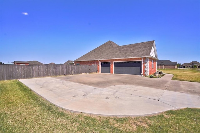 view of property exterior featuring a garage and a lawn