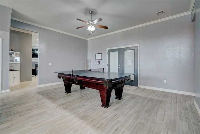 game room featuring french doors, ceiling fan, crown molding, and light hardwood / wood-style floors