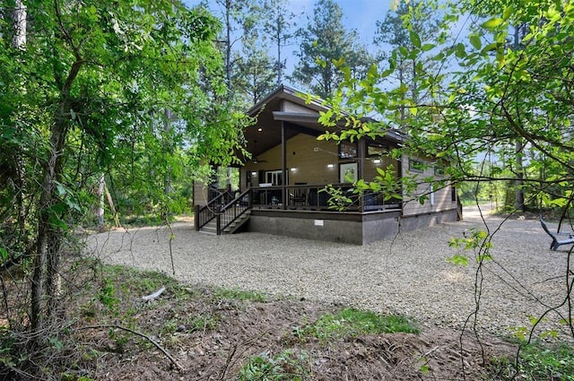 rear view of house featuring a porch