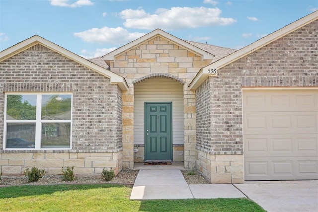 doorway to property featuring a garage