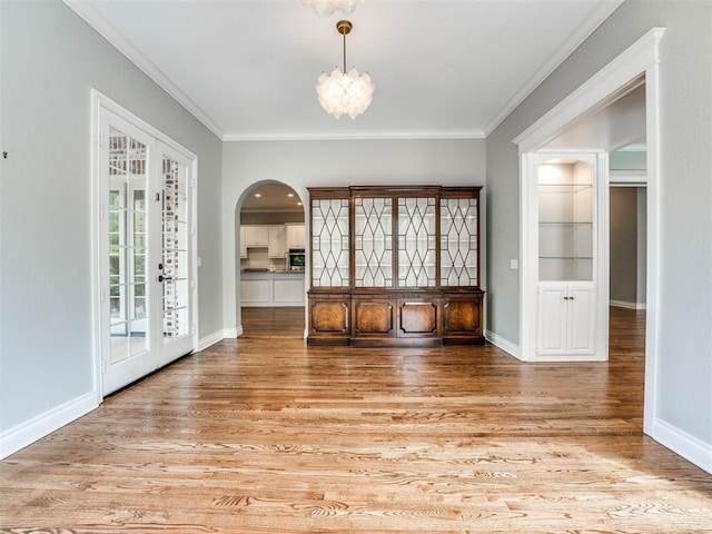 interior space featuring light hardwood / wood-style floors and ornamental molding