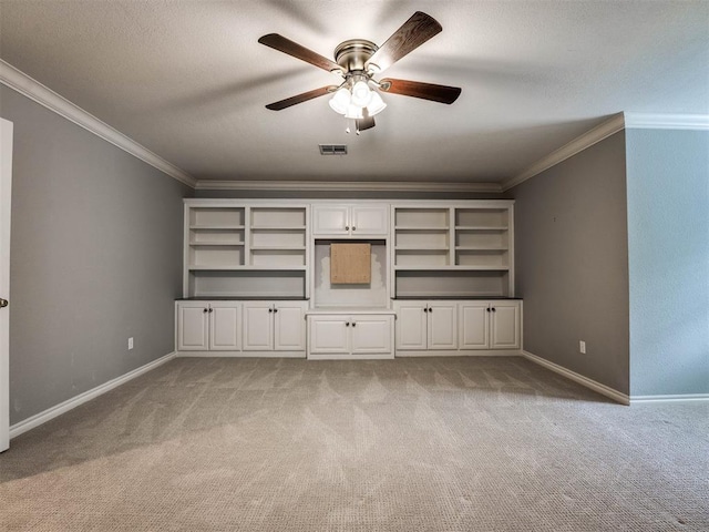 unfurnished living room featuring ceiling fan, light colored carpet, and ornamental molding