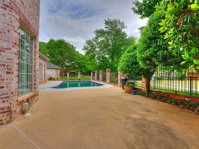 view of swimming pool featuring a patio