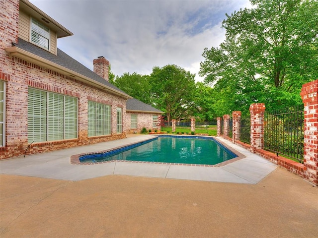 view of swimming pool featuring a patio