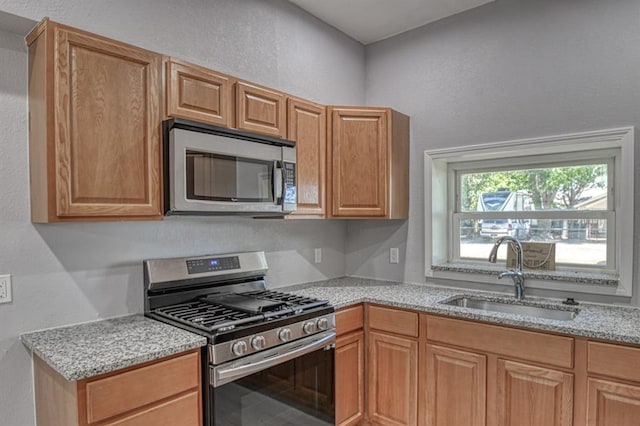 kitchen featuring stainless steel appliances and sink