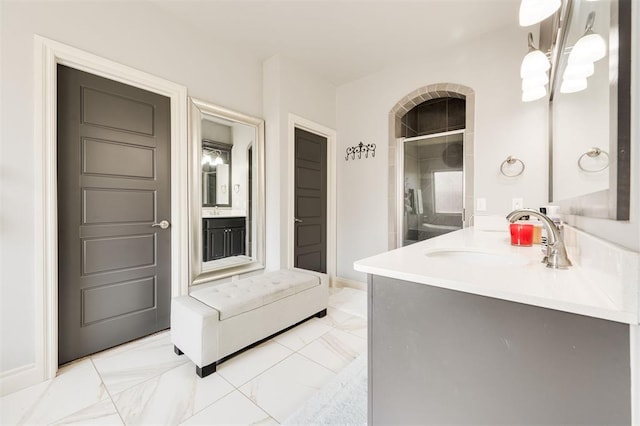 bathroom with vanity and an enclosed shower