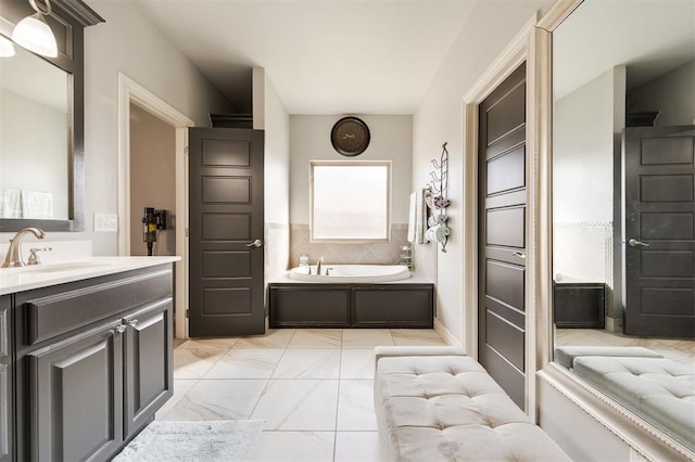 bathroom featuring vanity and a tub