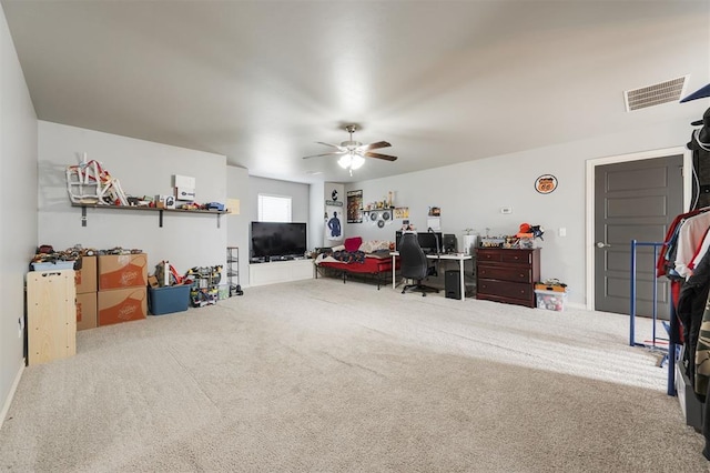 interior space with carpet floors and ceiling fan