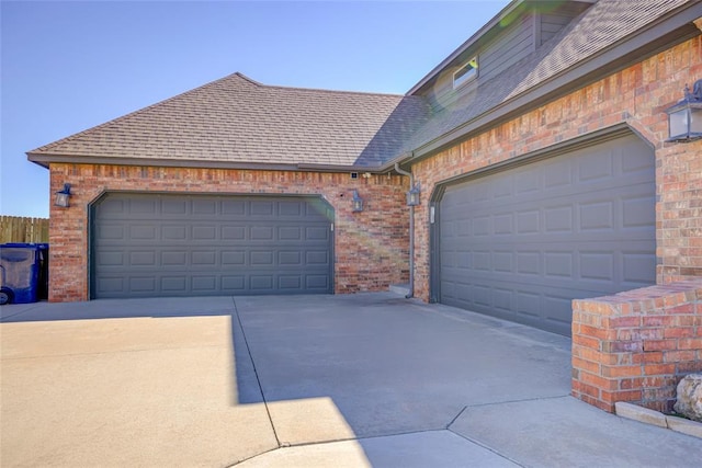 garage with concrete driveway