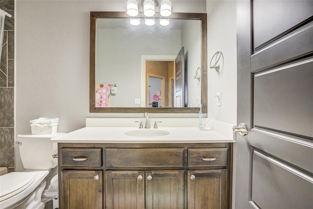 bathroom with vanity and toilet