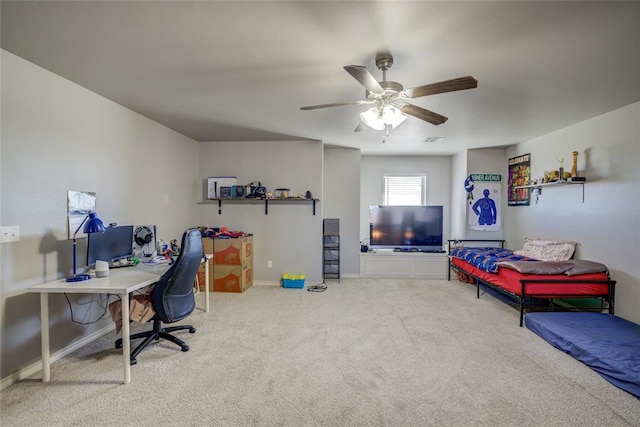 home office featuring carpet flooring, ceiling fan, visible vents, and baseboards