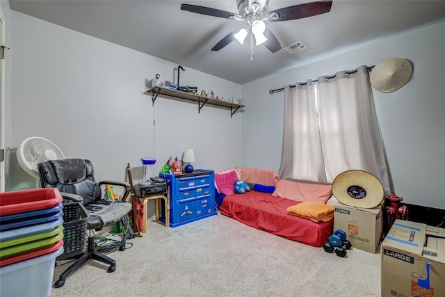 carpeted bedroom with visible vents and a ceiling fan