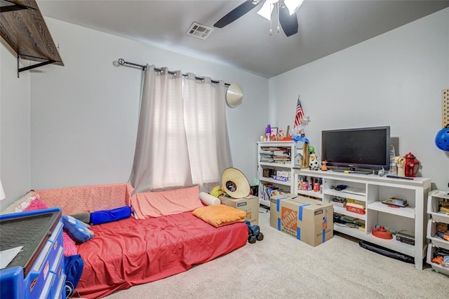 bedroom featuring carpet floors, visible vents, and a ceiling fan