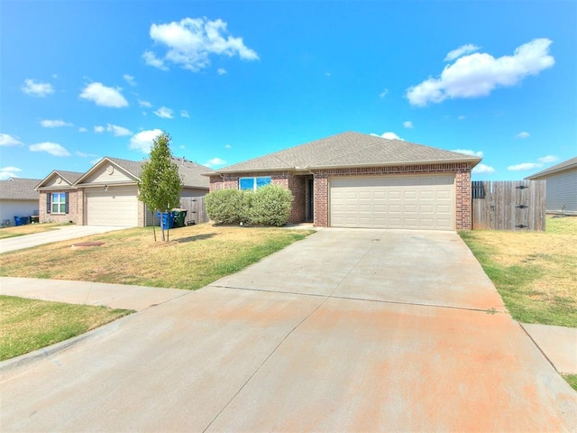 ranch-style home with a front yard and a garage