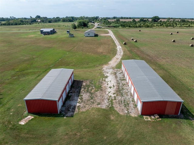 birds eye view of property featuring a rural view