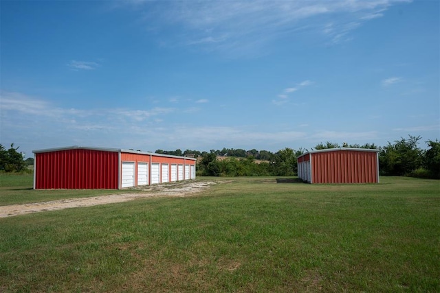 view of yard with an outbuilding and a garage