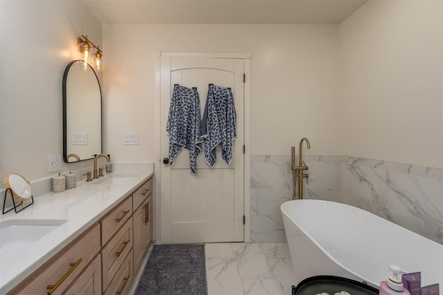 bathroom with a washtub, vanity, and tile walls