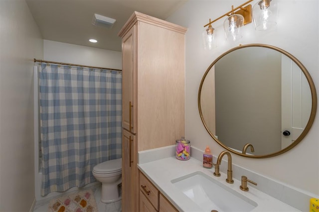 bathroom with walk in shower, vanity, and toilet