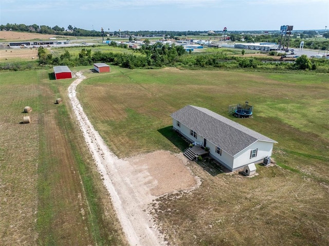 birds eye view of property with a rural view