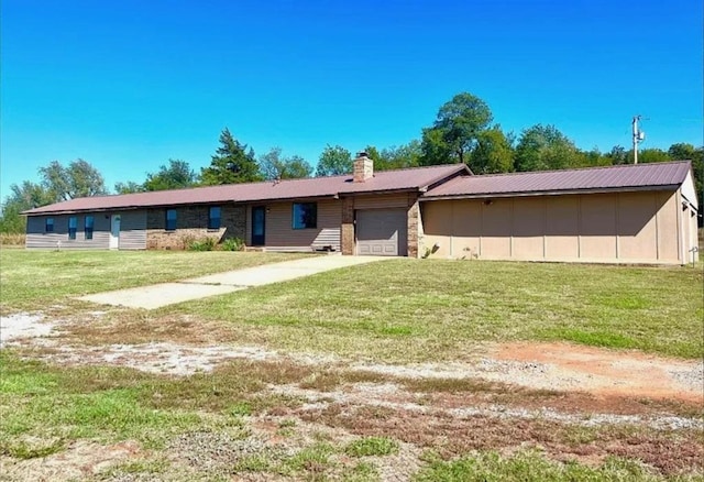 single story home featuring a front yard and a garage