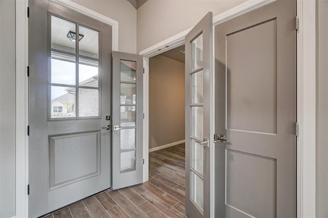 doorway with wood-type flooring and french doors