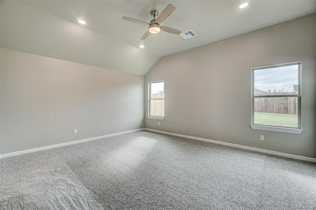 empty room with carpet, ceiling fan, and lofted ceiling