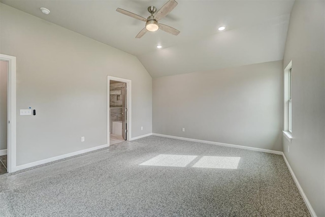 empty room featuring carpet floors, ceiling fan, and lofted ceiling