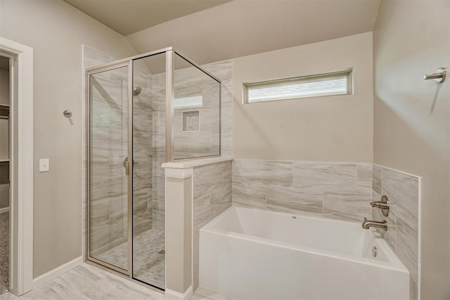 bathroom with separate shower and tub