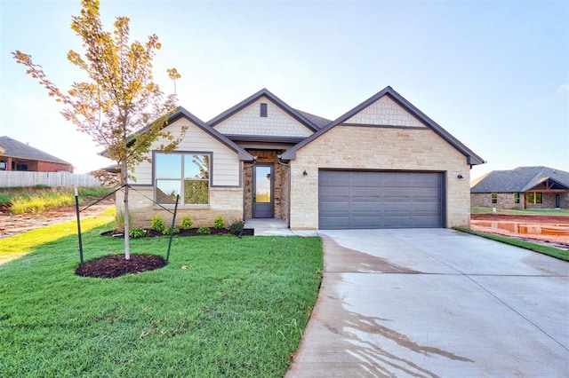 view of front of home featuring a front lawn and a garage