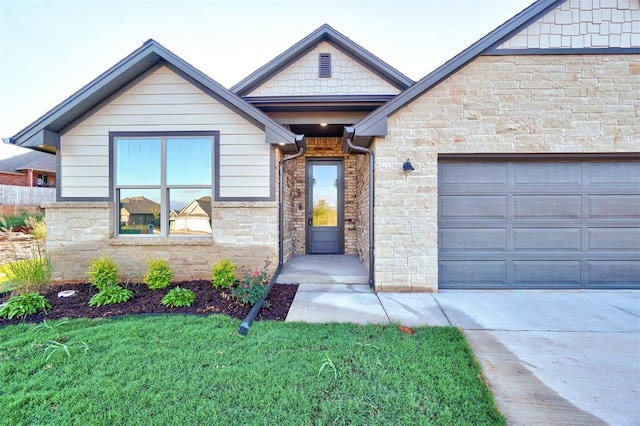 view of front facade with a front yard and a garage