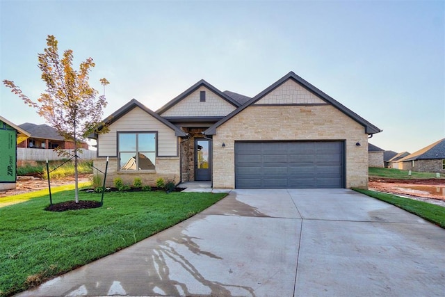 view of front facade with a garage and a front lawn