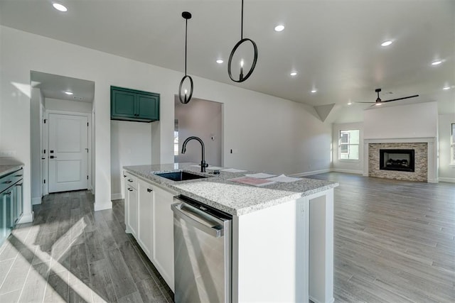 kitchen with dishwasher, sink, ceiling fan, light wood-type flooring, and white cabinetry