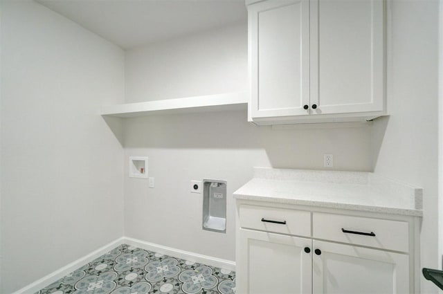 washroom featuring hookup for an electric dryer, cabinets, and washer hookup